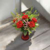 Ruby red roses with wax flower