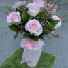 Pink roses with pink wax flower