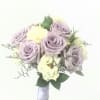 A classic rose and baby&#039;s breath bouquet hand tied with ribbon. The