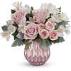 Soft and sweet, this pastel pink rose bouquet gets the glam treatment