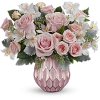 Soft and sweet, this pastel pink rose bouquet gets the glam treatment