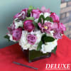 This piece includes, Roses, Orchids and Hydrangeas. 