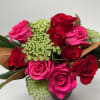 This lovely and traditional bouquet is featured a fluted red glass vase