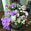 A lush, artful and grand mix of high-end seasonal flowers in pastel