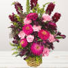 A multicolored funeral single-sided basket featuring roses, lilies, snapdragons, and more. Suitable
