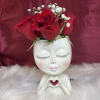 Beautiful container with a sweet face and fresh red roses for you.