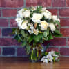 All white flowers are featured in this lovely bouquet. It conveys calm