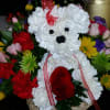 BEAUTIFUL AND LOVELY PUPPY WITH MIXED FLOWERS OR JUST RED ROSES