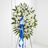 The Exquisite Tribute Standing Spray is an elegant display of sweet serenity.