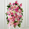 The Comforting Standing Spray combines blushing blooms in a classic standing design
