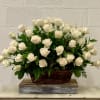 A beautiful, bountiful basket of luminous white roses that feels so fresh