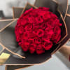 Red Roses Bouquet Wrapped in Black and Gold Floral Paper.
