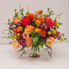 Enjoy this stunning bright table bouquet with mixed colored roses and blooms.
A