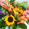 Colorful. Uplifting. Whimsical. 

This cheerful, garden-style display features sunflowers, snapdragons or stock