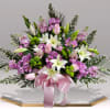 The Heartfelt Remembrance Sympathy Basket is a beautifully arranged floral display designed