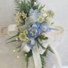 this beaultiful blue garden wrist corsage created with seasonla blooms in a