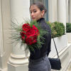 A bouquet of premium red garden roses with greenery is an elegant