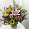This stunning bouquet is full of fresh Spring blooms in many shades