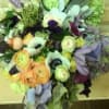 Stylish medley in purple, peach, white and green hues, presented in a