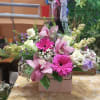 Beautiful purse decorated with orchids and roses, with a touch of lisianthus