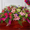 The Radiant Tribute Casket Spray adds a brilliant spectrum of pinks, greens