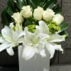 Gorgeous White Premium Roses with White Lilys and green accents. 