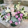 Celebrate a special occasion with a soft arrangement of pink and yellow