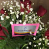 6 red roses arranged in glass vase w $15 Dutch Bros. gift