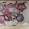 1- Giant Unicorn Head
2- 18in Star Mylars 
2- 18in Unicorn Mylars
All tied