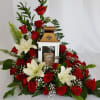 A thoughtful expression of sympathy. A keepsake lantern surrounded by beautiful roses