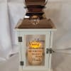 A thoughtful expression of sympathy. A keepsake lantern surrounded by beautiful roses