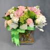 A perfect mix of pink roses, orchids, stock and other seasonal fillers