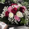 One Dozen Roses. White, Red &amp; pink roses with babies breath. Wrapped
