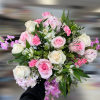 A combination of pink and white roses and other seasonal flowers.

We offer
