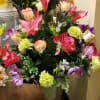 A cemetery cone made with silk flowers of fine quality.  Arranged