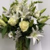 This monochromatic white arrangement is an elegant display that conveys your thoughts.