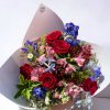 A bouquet of 5 red roses, pink and blue flowers for any