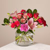 Let your love bloom. Roses, lilies &amp; carnations in a glass vase