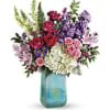 What a beauty! Shimmering with a glorious iridescent finish, this breathtaking, hand-blown