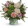 This unique bouquet features cr&egrave;me roses, peach carnations, miniature white carnations, light
