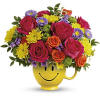 Happiness, delivered! Colorful roses in a cheerful ceramic mug are the quickest