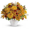 Invigorating as an autumn sunrise, this golden fall bouquet will lighten up