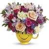 Send a cuppa cheer with this happy surprise of colorful roses and