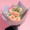 A bouquet of 3 pink roses and other seasonal flowers.
Deluxe size had