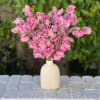 20 stems of gorgeous sweet peas in a ceramic bud vase. 