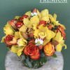 Cute and unique vase complemented with Roses, Tulips, Orchids, and Greens.

Note: The