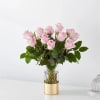 The picture perfect petals of pink roses gracefully unfold, showcasing their timeless