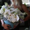 So beautiful light blue box with fresh orchids,garden roses, lisianthus and other