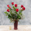 One dozen long stemmed red roses arranged in our ruby rose vase
