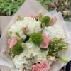 A all around loose bouquet arrangement of vibrant flowers and bright white